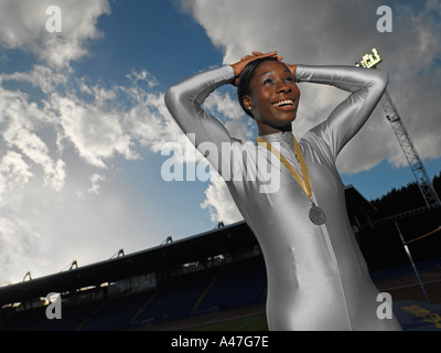 Female athlete wearing a medal Stock Photo