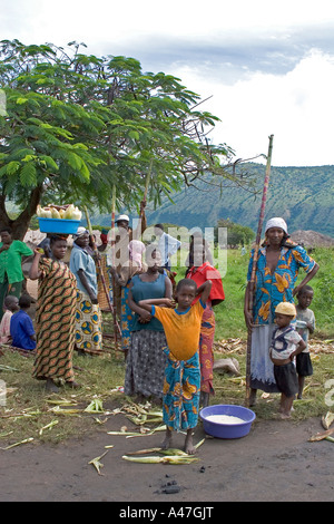 Local people buying and selling in market of remote fishing village, Lake Albert, Northern Uganda, East Africa Stock Photo