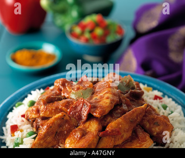 A colourful setting of Indian chicken curry and rice editorial food Stock Photo