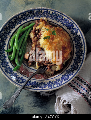 Overhead shot of shepherds pie with French beans editorial food Stock Photo