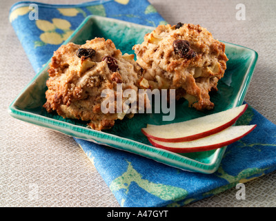 Two apple rock cakes on a plate with apple slices editorial food Stock Photo