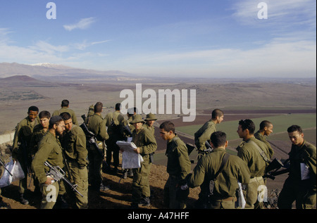 Israeli soldiers with maps studying the strategic layout of the golan Heights on the Syrian border Stock Photo