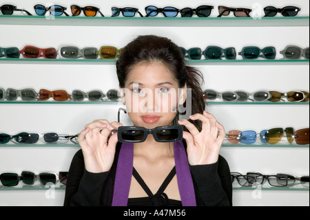 Woman shopping for sunglasses Stock Photo