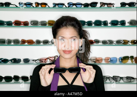 Woman shopping for sunglasses Stock Photo