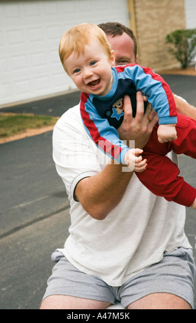 Dad and baby boy playing outside Stock Photo
