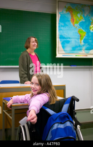 Disabled girl in classroom Stock Photo