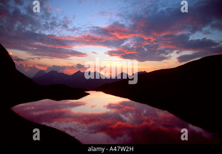 A dramatic sunset over Rappensee in the Bavarian Alps Stock Photo