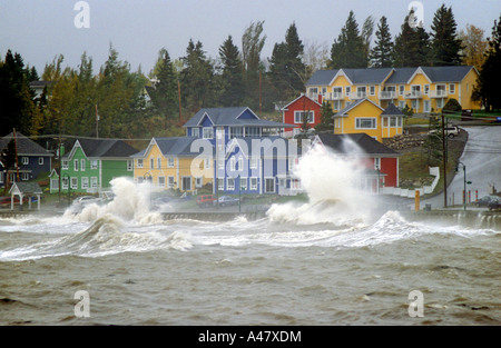 Large waves pounding the coastal village of St Luce in Quebec Stock Photo