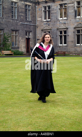 Young woman dressed in the traditional graduation gown on graduation day at St Andrews University Stock Photo