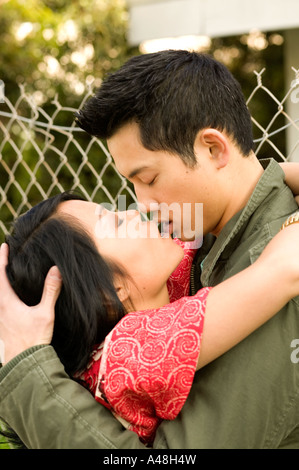 Young man and woman kissing Stock Photo