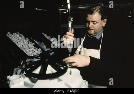 worker assembling washing machines parts Hoover factory south wales 1992 Stock Photo