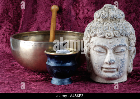 Buddha head and sounding bowl Stock Photo