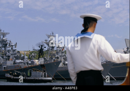 Russian sailor on sentry watch on his ship in sebastopol dockyard black sea crimea ukraine Stock Photo