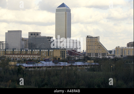 canary wharf tower next to commercial buildings and  residential high rise blocks docklands london Stock Photo