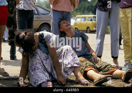 women refugees from srebrenica collapse in grief on  learning that their husbands or loved ones are  dead.Tuzla July 1995 Stock Photo