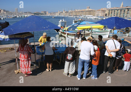 View of animated characteristic traditional fish market Vieux Old Port Marseille Provence Southern France Europe Stock Photo