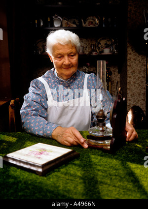 UK Shropshire Ironbridge Blists Hill Museum maid Irene Pryce in the doctors parlour Stock Photo