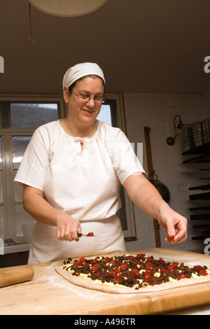 UK Shropshire Ironbridge Blists Hill Victorian Town traditional bakery Caroline Ward making Christmas Chelsea buns Stock Photo
