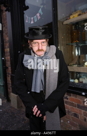 UK Shropshire Ironbridge Blists Hill Victorian Town Actor in character of Ebenezer Scrooge at Christmas Stock Photo