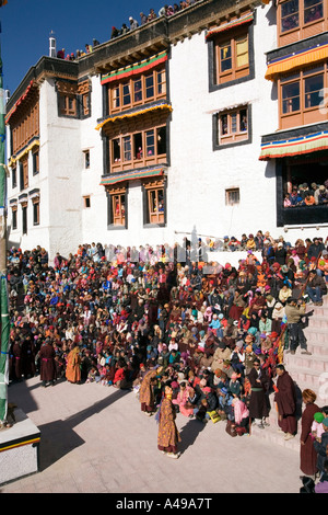 India Ladakh Leh Valley Spitok Gompa festival pilgrims watching dance in mnastery courtyard Stock Photo