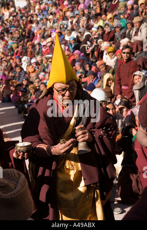 India Ladakh Leh Valley Spitok Gompa festival yellow hat monk praying with bell and dorji Stock Photo