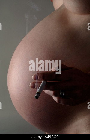 Pregnant pregnancy cigarette smoking smoker cigarettes pregnant smoking Stock Photo