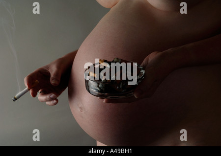 Pregnant pregnancy cigarette smoking smoker cigarettes Stock Photo