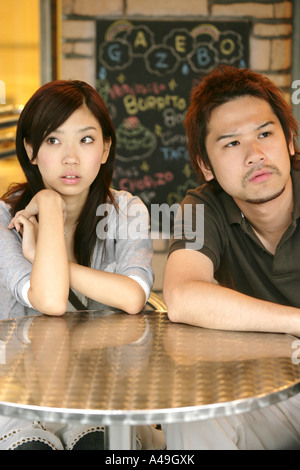 Close up of a young couple sitting at a table Stock Photo