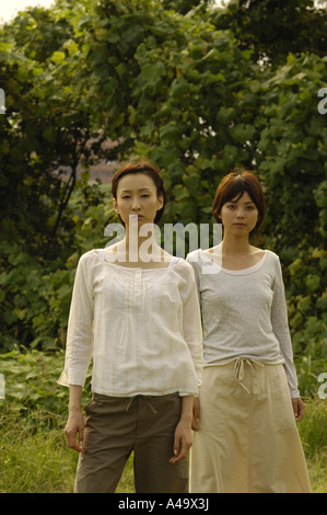 Portrait of two young women standing together Stock Photo