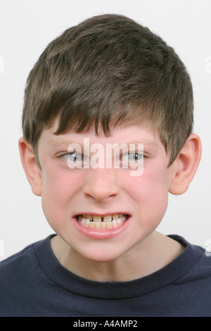 An eight year boy grimacing, February 2006. Stock Photo