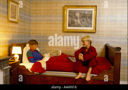 Two boys in their dormatory.The school has an annex at Saveterre Chateau near Toulouse, France Stock Photo