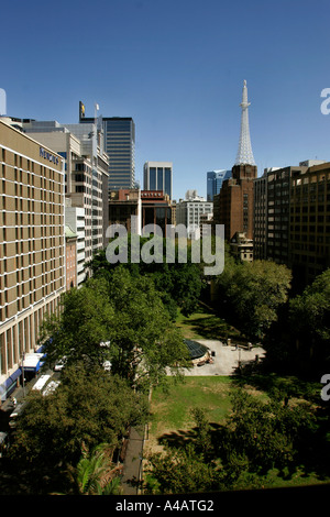 An unusual view of central Sydney Wynyard Park in Sydney with AWA radio tower in background Stock Photo