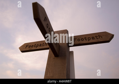 A footpath sign at dawn in Swaledale Yorkshire Dales National Park ...