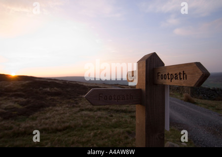 A footpath sign at dawn in Swaledale Yorkshire Dales National Park ...