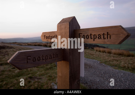 A footpath sign at dawn in Swaledale Yorkshire Dales National Park ...