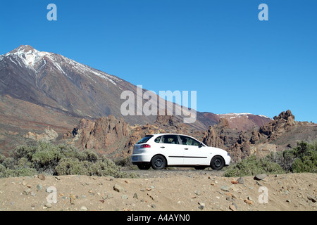 Touring in the Teide National Park Tenerife Canary Islands Spain snow capped summit mount Teide Stock Photo