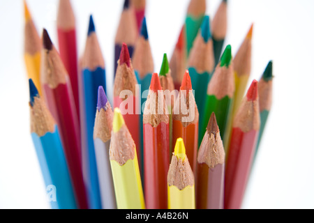 group of coloured pencils in a jar on a white background Stock Photo