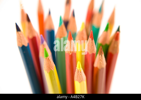 group of coloured pencils in a jar on a white background Stock Photo
