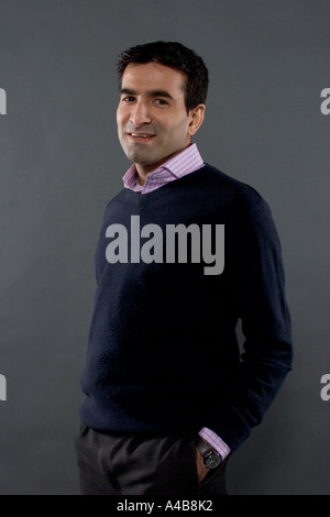 Happy man with hands in pockets Stock Photo