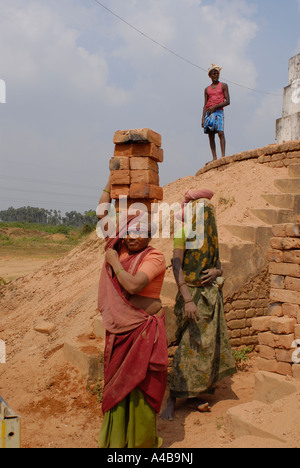 Stock image of Dalit tribal village girl working in an adobe brick factory near Chennai Tamil Nadu India Stock Photo