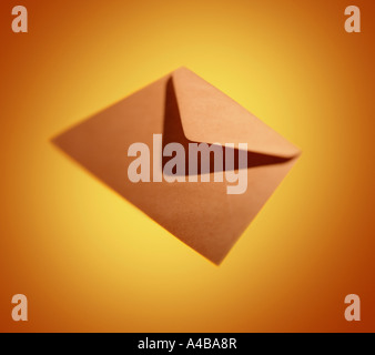 A flying envelope on a yellow background, Stock Photo