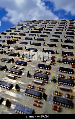 Microprocessor chips on computer circuit board with sky as backdrop Stock Photo