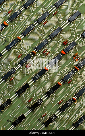 Rows of microprocessor chips on computer circuit board with electrical printed tracks Stock Photo