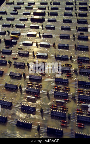 Rows of microprocessor chips catching the light on computer circuit board with electrical printed tracks Stock Photo
