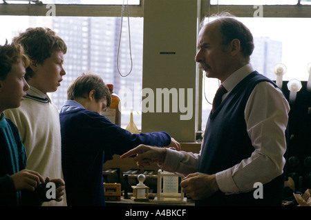 TEACHER & PUPILS IN LABORATORY DURING SCIENCE LESSON Stock Photo