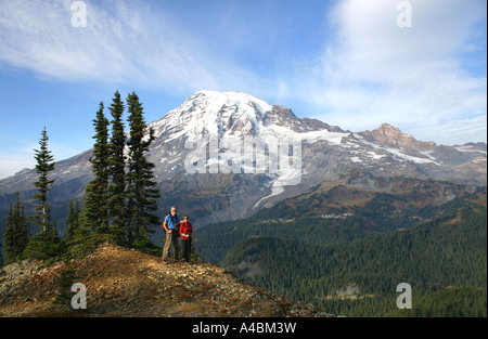 39,013.08982 two hikers, couple with landscape Mt Rainier, Mount Rainier National Park hikers, Washington state, USA, mountain fresh air and blue sky Stock Photo
