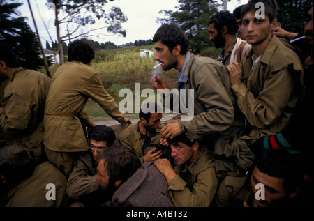 OCHAMCHIRE, GEORGIA, 29th SEPTEMBER 1993: Demoralized government soldiers, many of them volunteers, retreat from the front line.  They were later disarmed by ex-president Gamzakurdia's soldiers.   Two days later Ochamchire fell to advancing Abkhazian forces. Stock Photo
