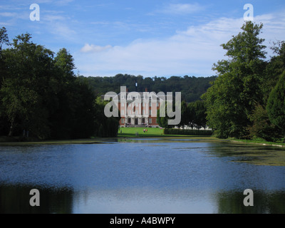Chevening House viewed across the lake with the keyhole visible in the trees behind Chevening Kent UK Stock Photo