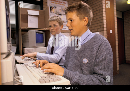 TWO BOYS USING COMPUTERS AT A STATE SECONDARY SCHOOL. Stock Photo