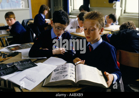 Boys work together in class on a history project at a state secondary school. Stock Photo